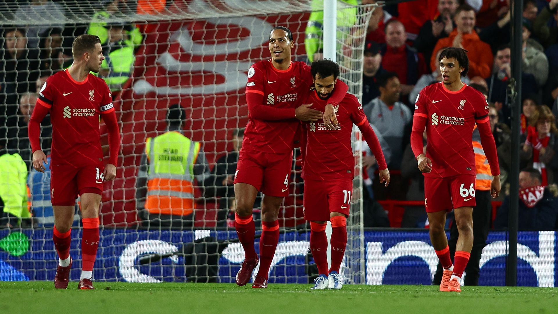 Virgil van Dijk celebrating with Mohamed Salah