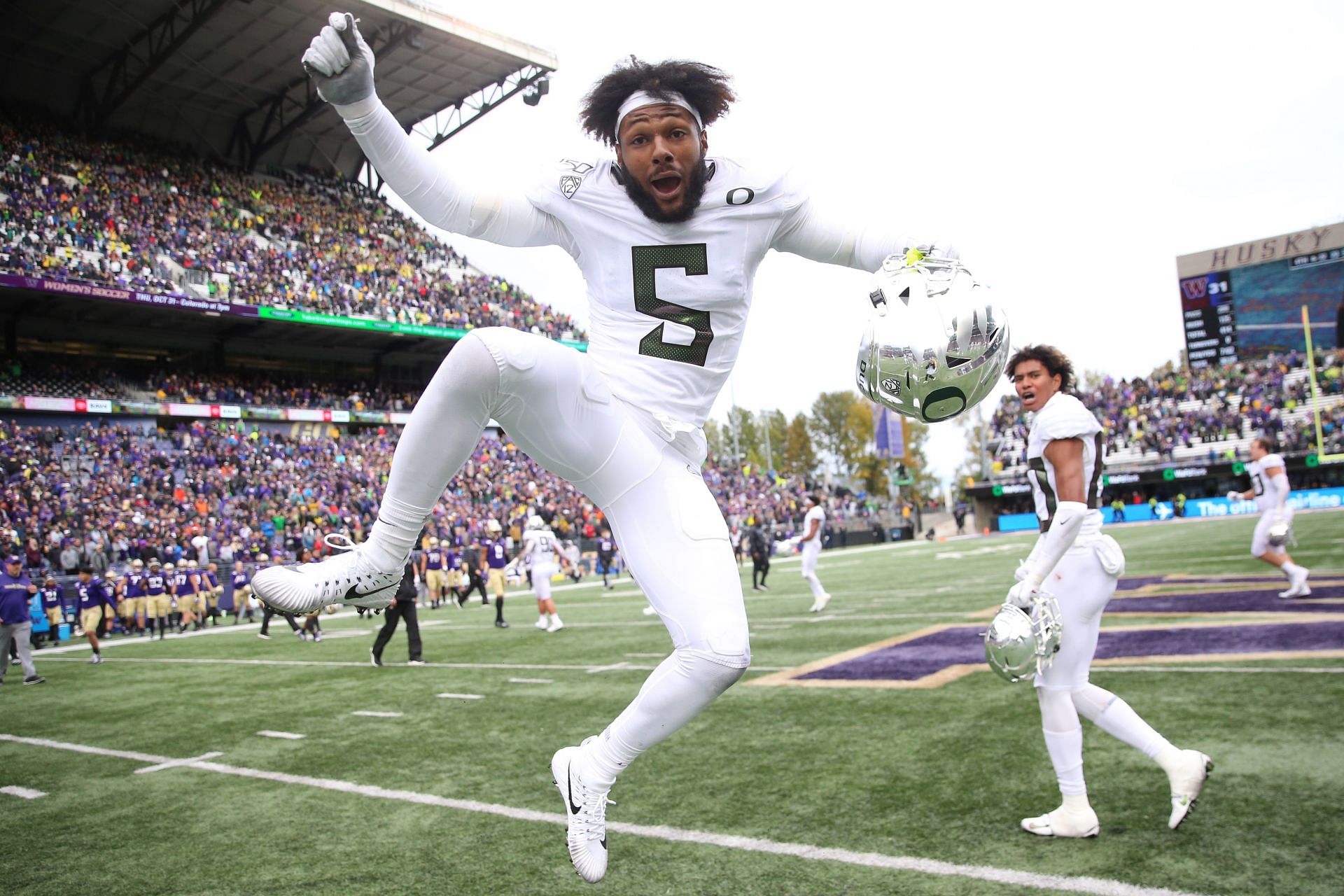 Kayvon Thibodeaux #5 of the Oregon Ducks celebrates after defeating the Washington Huskies 35-31 during their game at Husky Stadium on October 19, 2019 in Seattle, Washington.