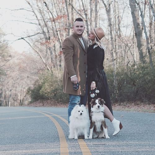 Mike Trout & Jessica Cox poses for an IG post with their Dogs.