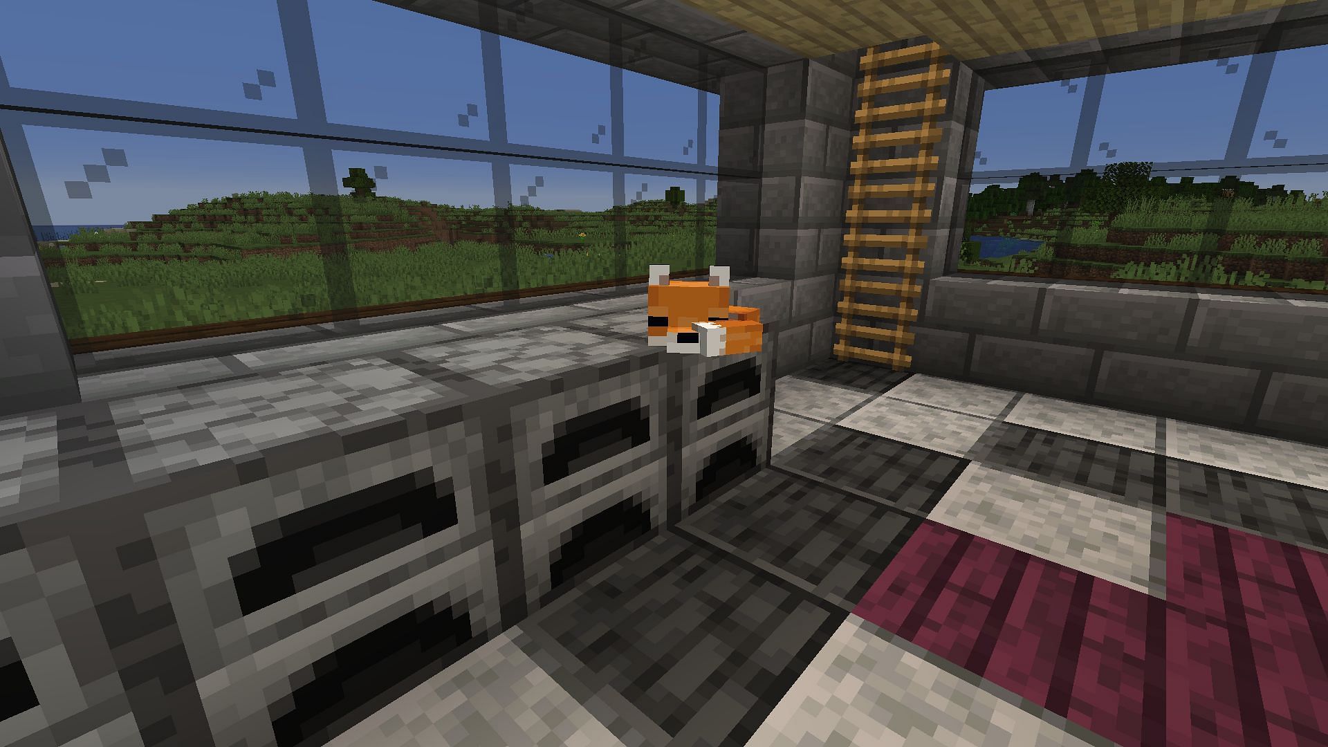 A baby fox curled up on a player&#039;s furnace (Image via Minecraft)