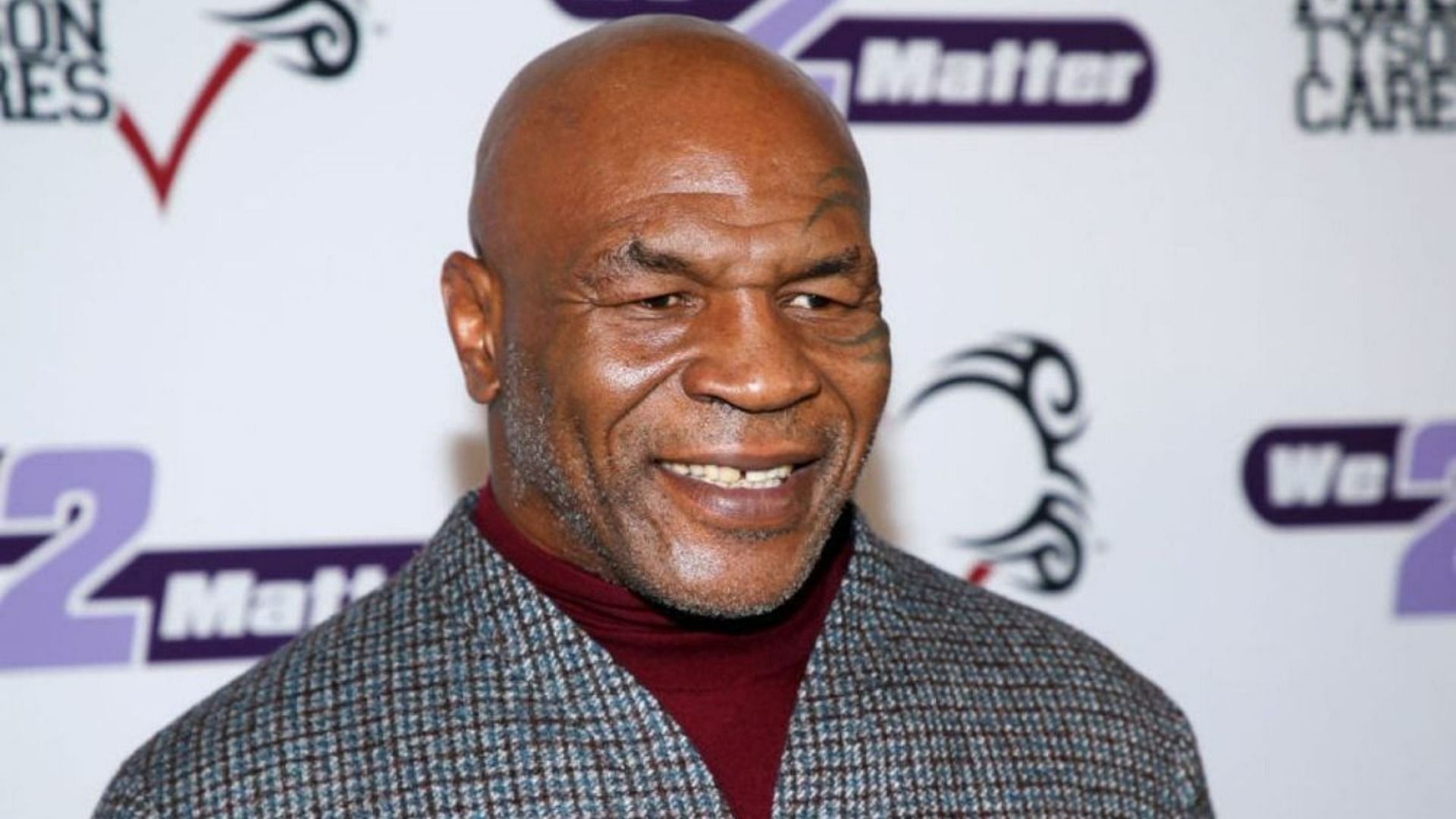 Mike Tyson reportedly punches flight passenger (Image via Getty Images)