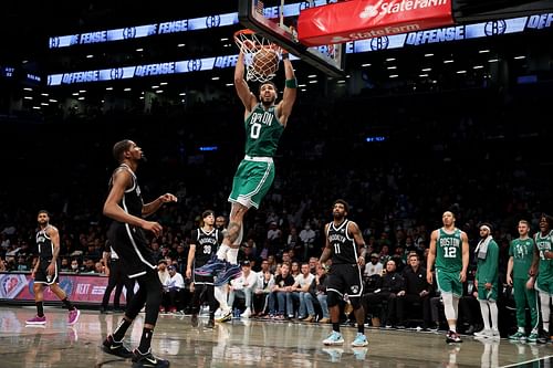 The Boston Celtics' Jayson Tatum seen throwing it down against Brooklyn Nets star Kevin Durant in Game Three