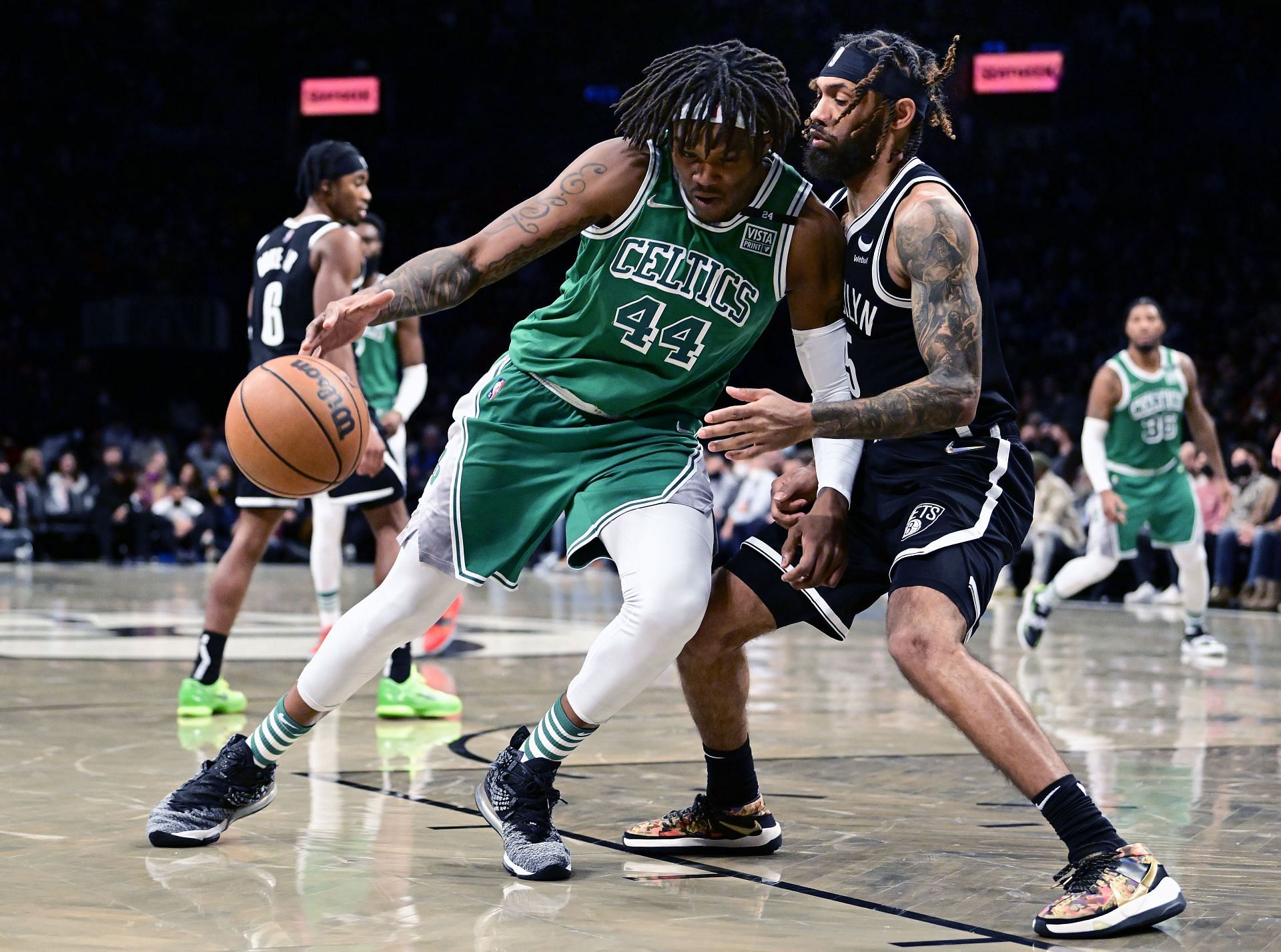Robert Williams III (#44) of the Boston Celtics is defended by DeAndre&#039; Bembry (#95) of the Brooklyn Nets