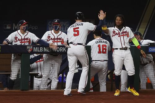 Ronald Acuna Jr congratulates Freeman after a homerun in the 2021 NLCS