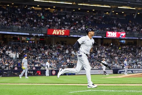 Aaron Hicks rounds the bases after hitting a home run against the Blue Jays