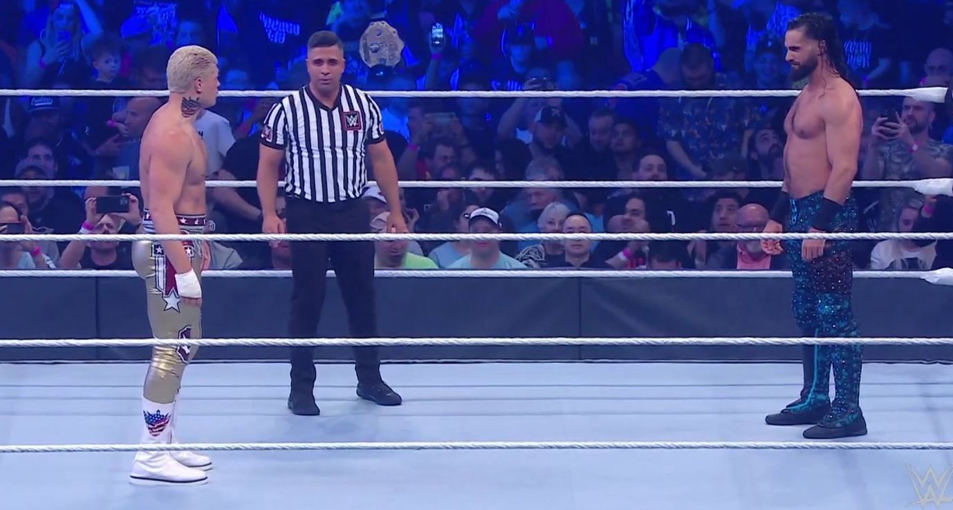 Cody Rhodes and Seth Rollins stare at each other before their match