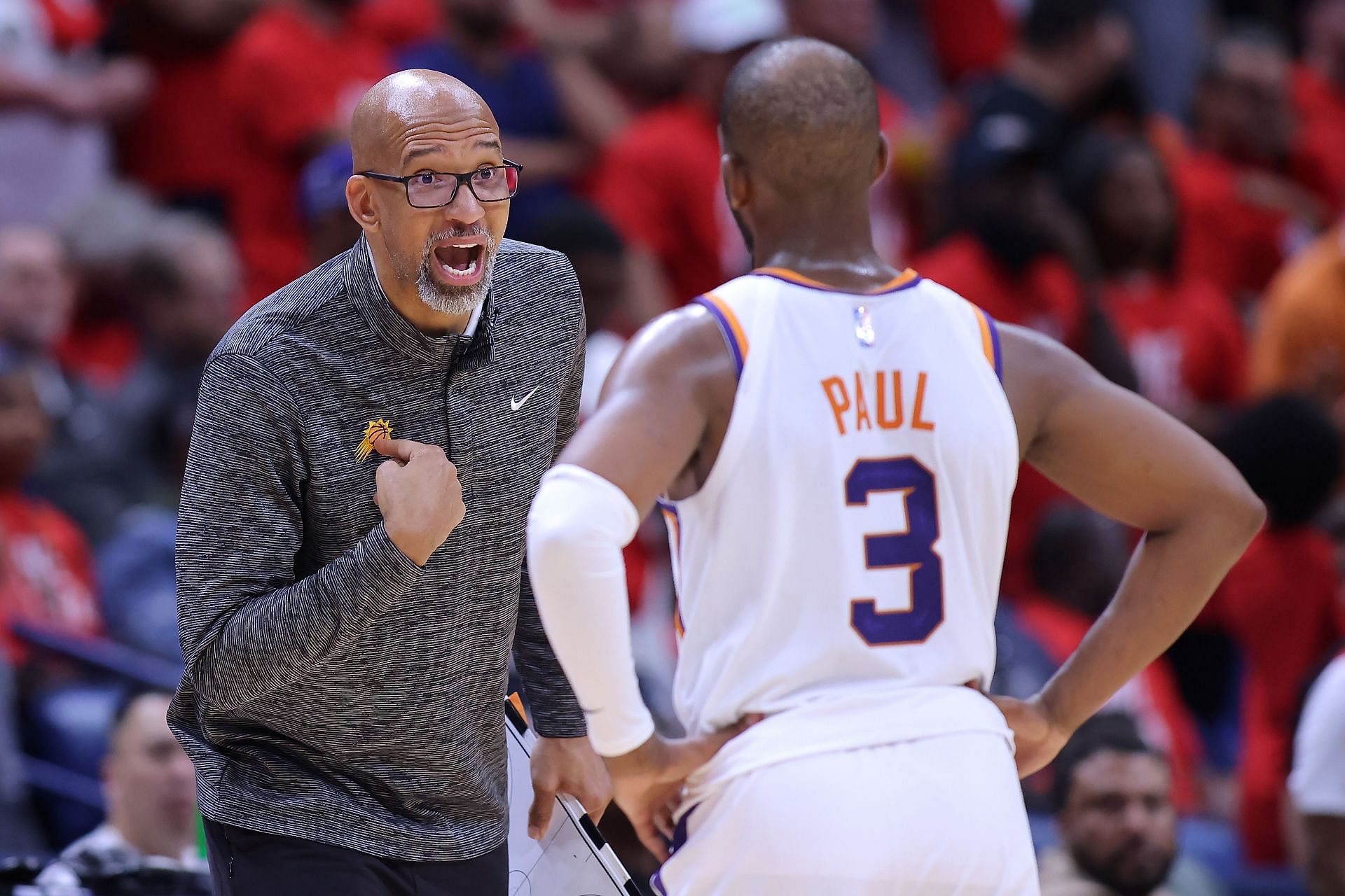 Head coach Monty Williams of the Suns talks to Chris Paul