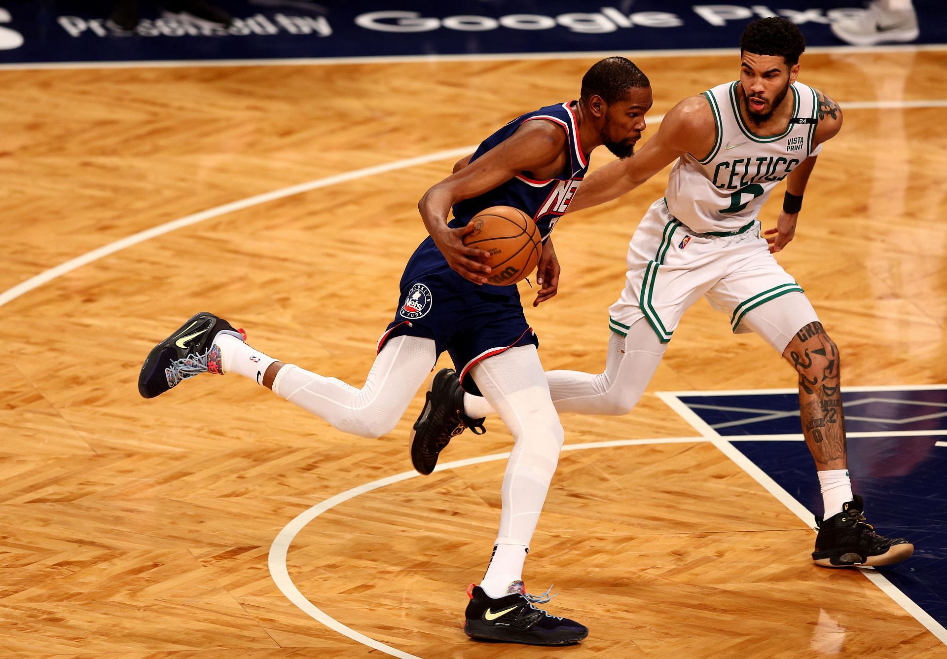 Durant #7 of the Brooklyn Nets heads for the net as Jayson Tatum #0 of the Boston Celtics defends