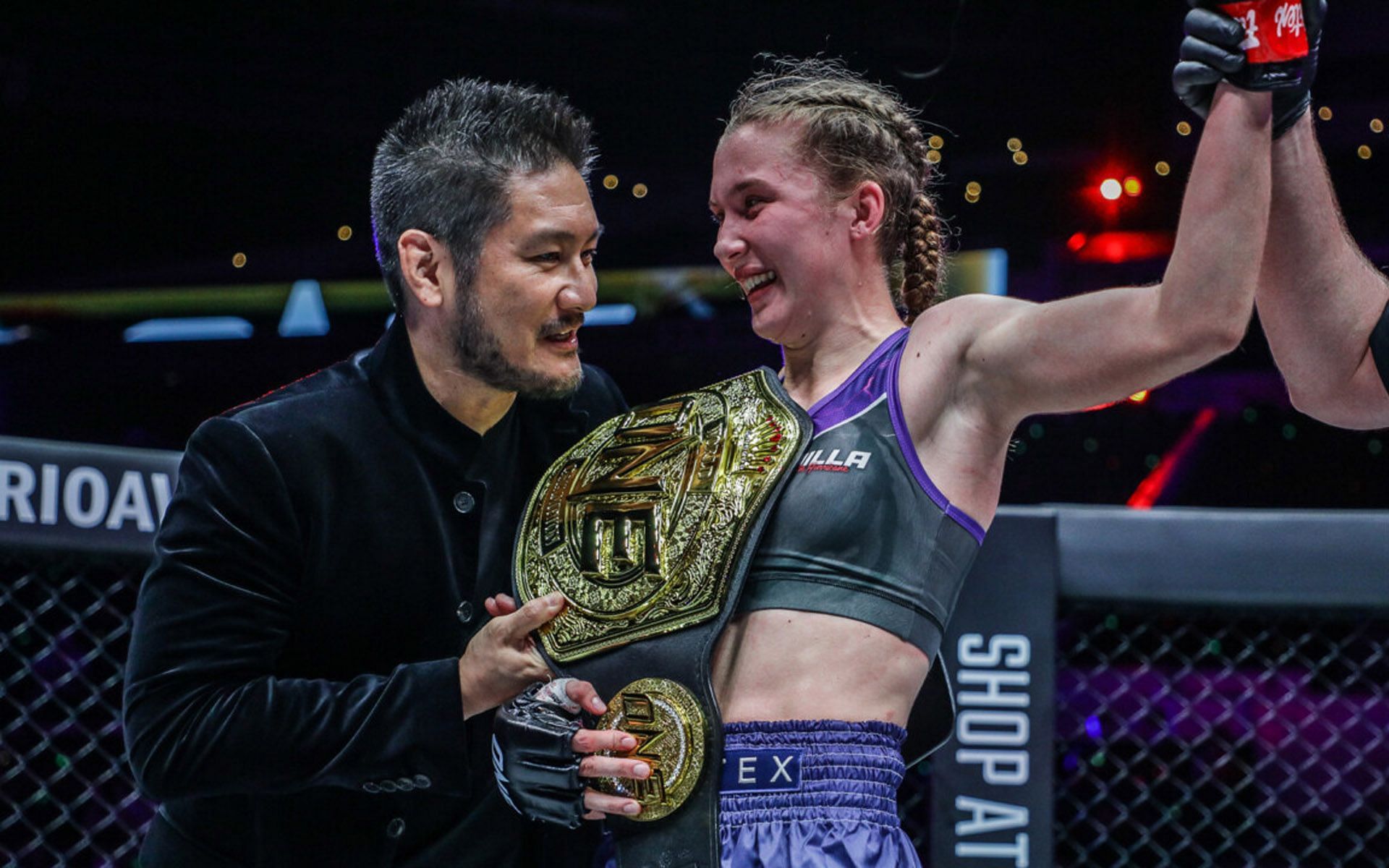 ONE Chairman and CEO Chatri Sityodtong (L) congratulates Smilla Sundell (R) for winning the world title. | [Photo: ONE Championship]