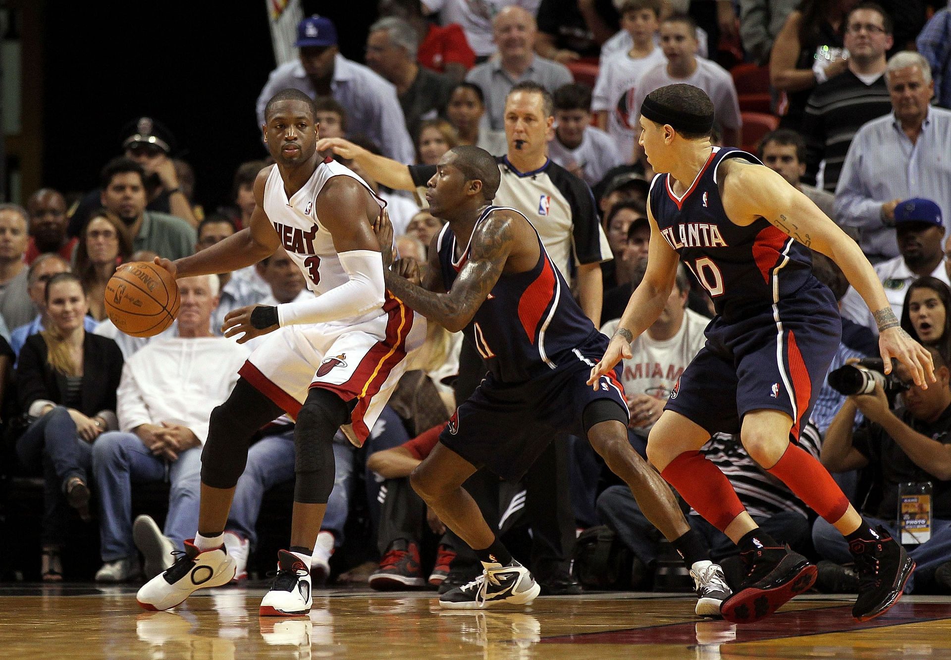 Dwayne Wade and Jamal Crawford go head-to-head during their playing days years ago during the Miami Heat v Atlanta Hawks game.