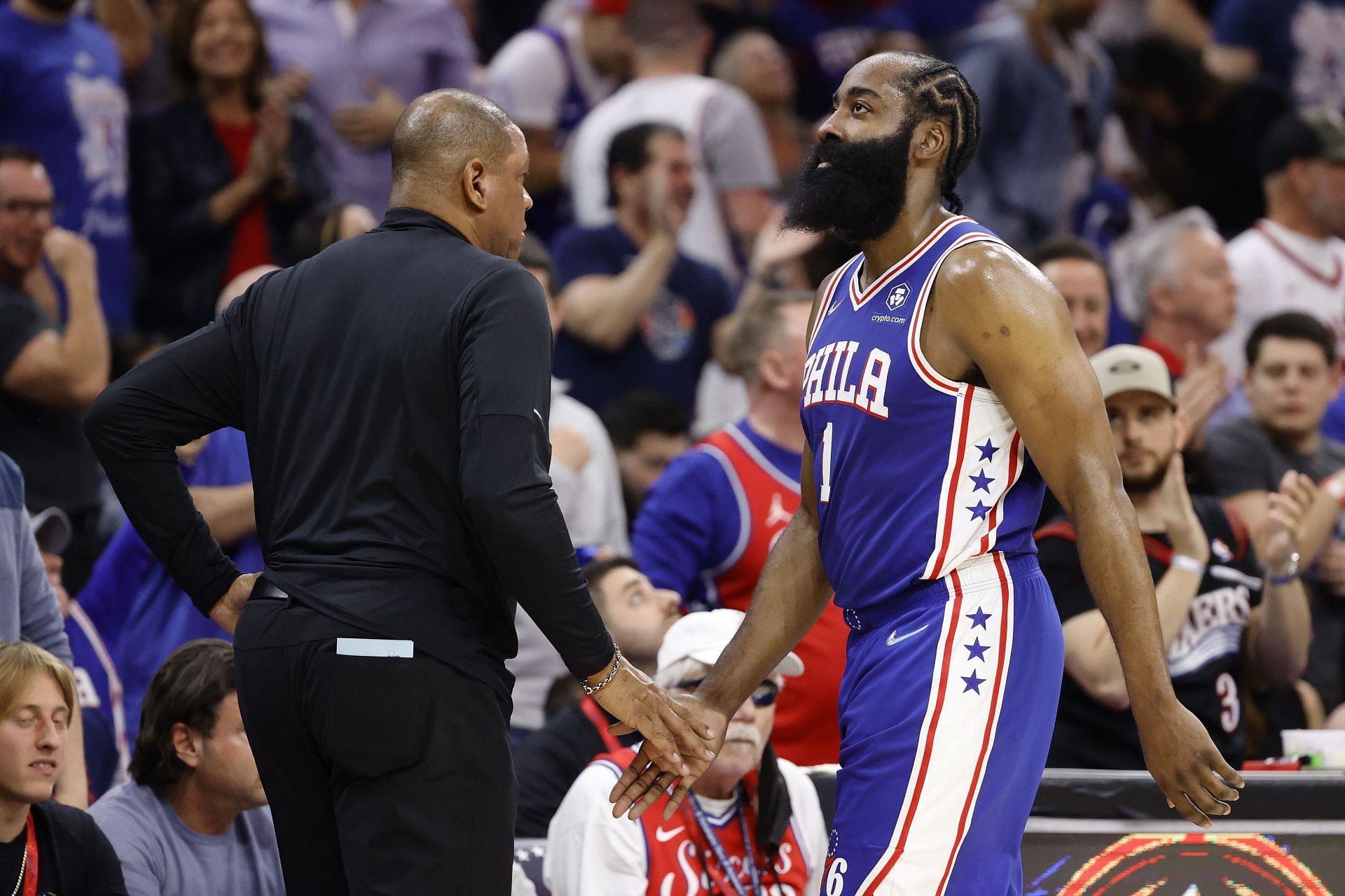 Head coach Doc Rivers and James Harden No. 1 of the Philadelphia 76ers shake hands.