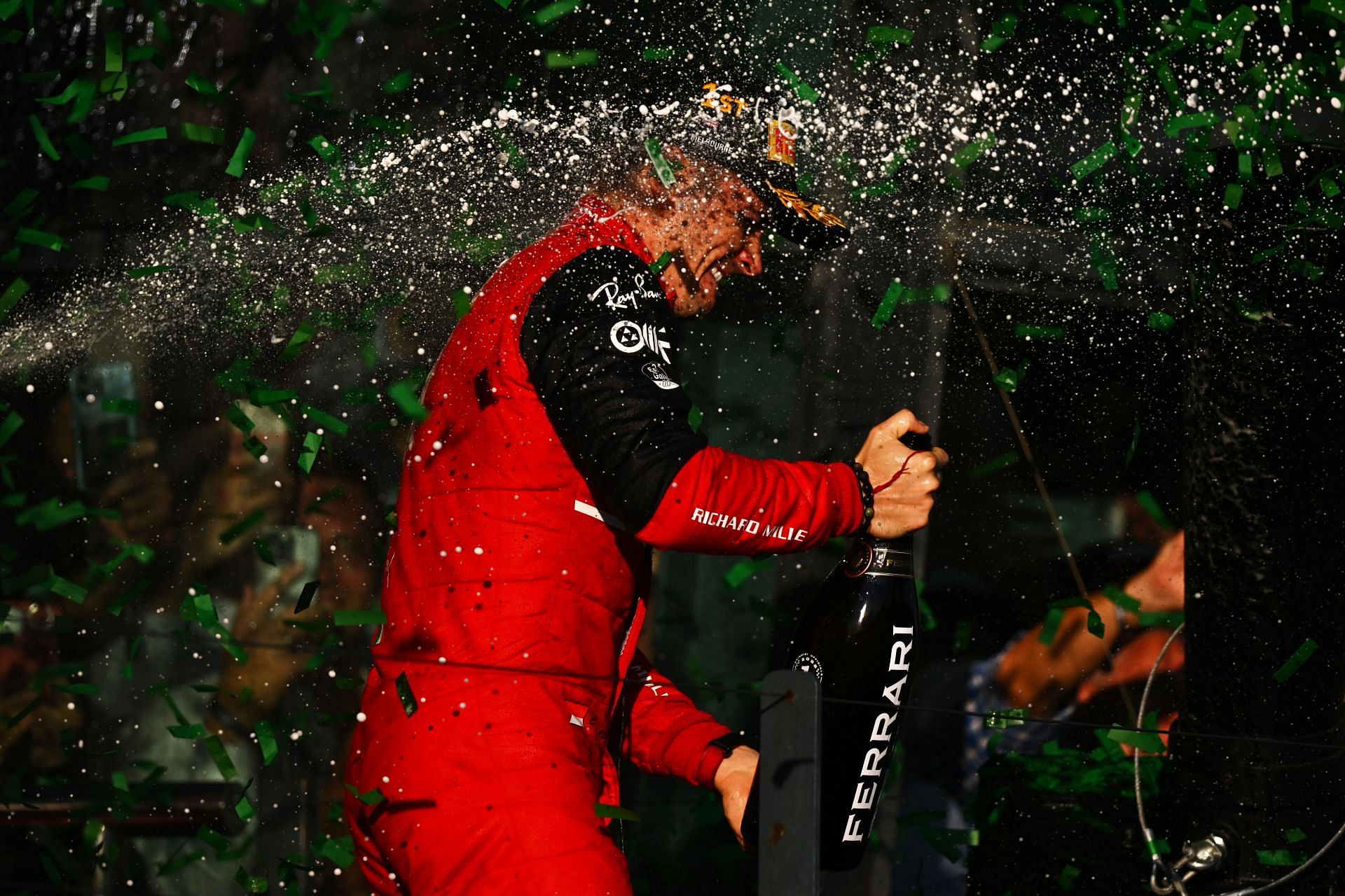 Ferrari&#039;s Charles Leclerc celebrates on the podium after winning the 2022 F1 Australian GP (Photo by Clive Mason/Getty Images)