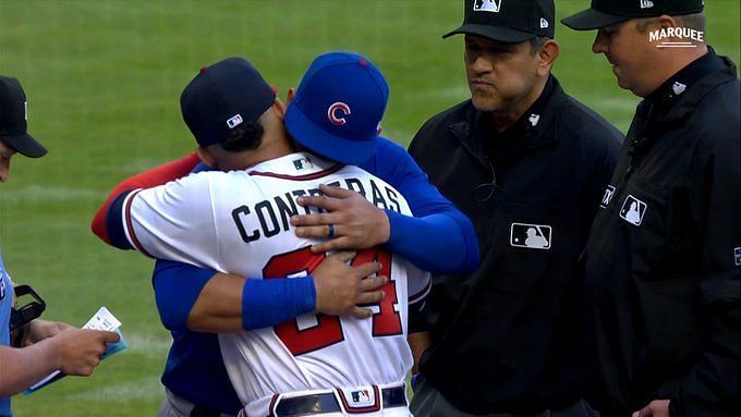 Brothers Willson and William Contreras exchange lineup cards before  Cubs-Braves game