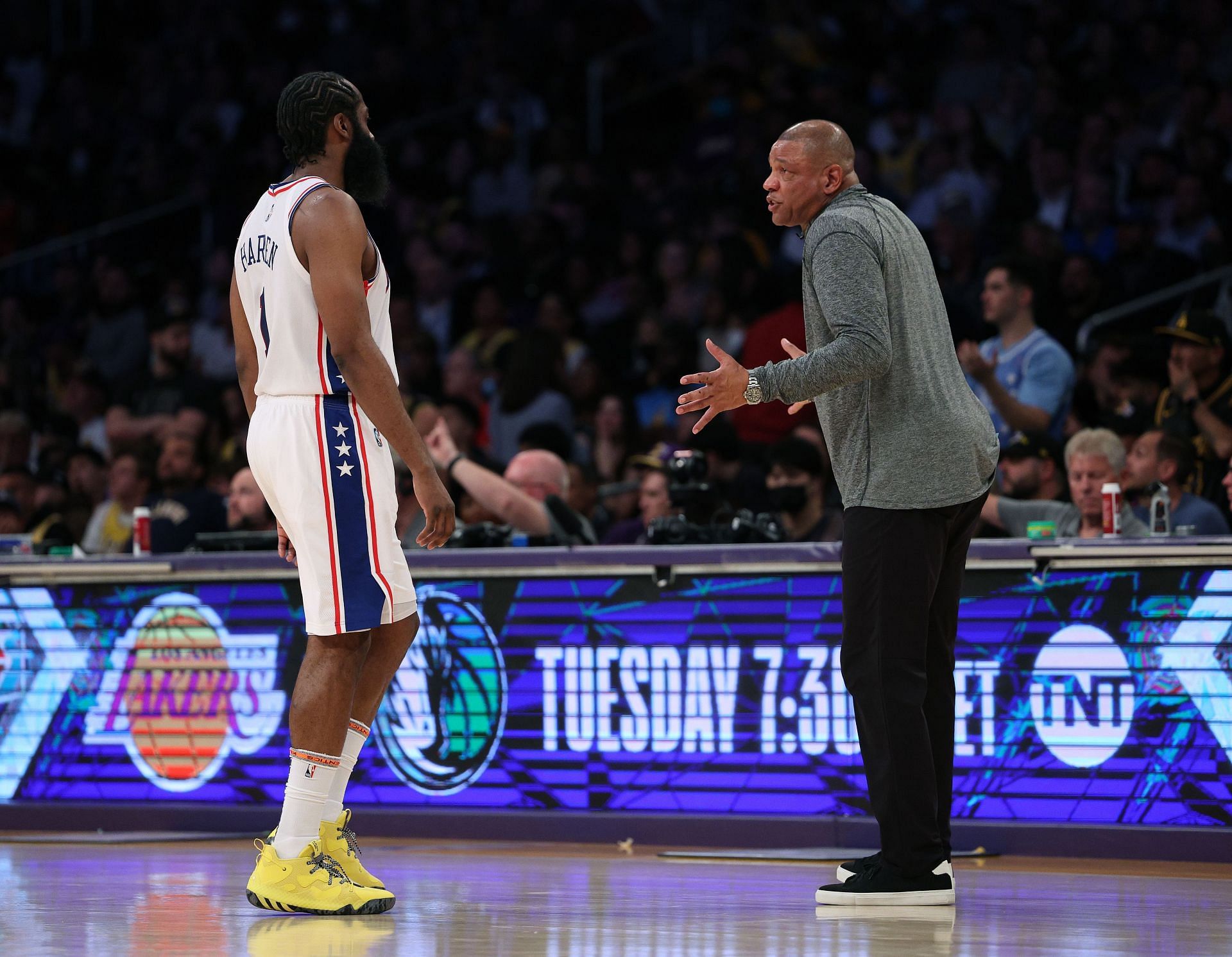 James Harden and Doc Rivers interact during a game