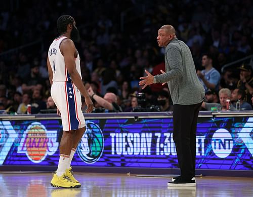 James Harden and Doc Rivers interact during a game