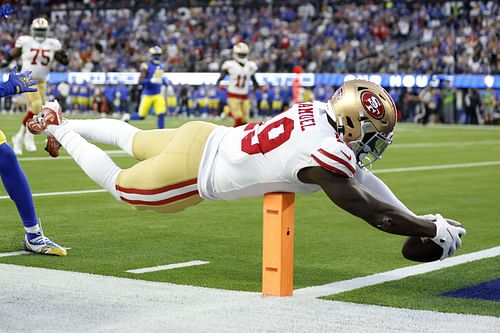 Niner's wide receiver Deebo Samuel dives across the pylon for the inzone