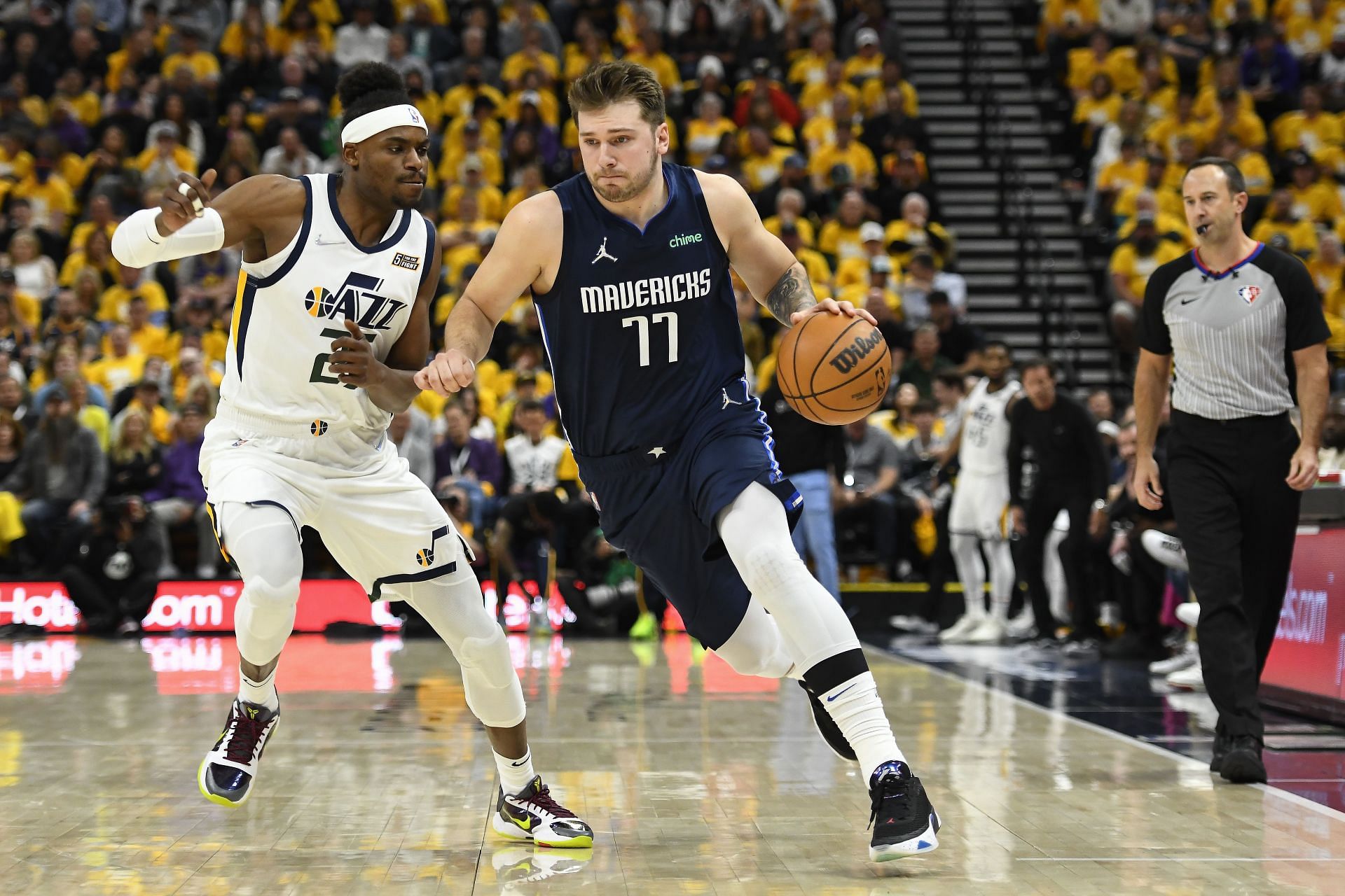 Luka Doncic of the Dallas Mavericks drives past Danuel House Jr. of the Utah Jazz