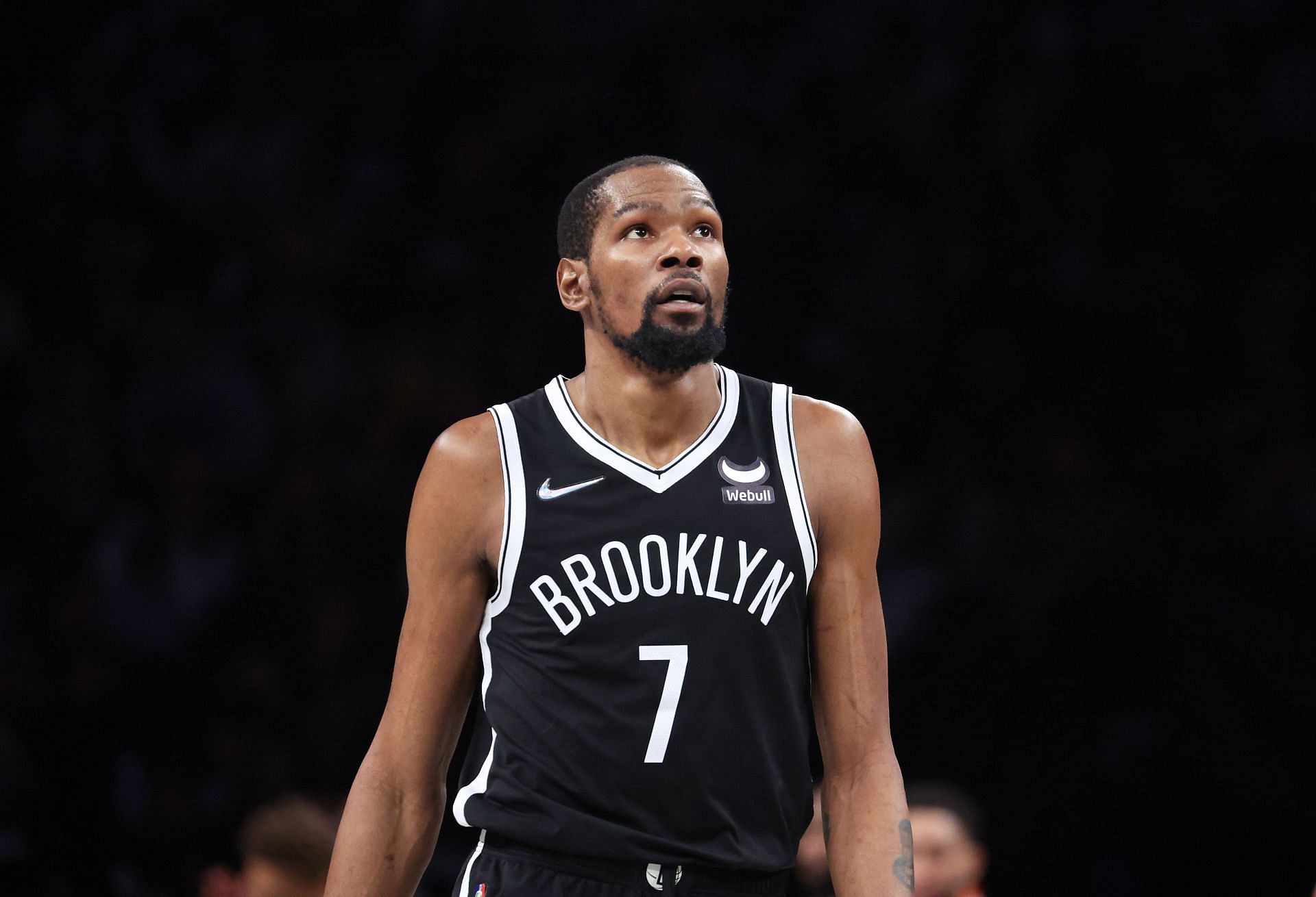 Kevin Durant #7 of the Brooklyn Nets looks on against the Boston Celtics during Game Three of the Eastern Conference First Round NBA Playoffs at Barclays Center on April 23, 2022 in New York City