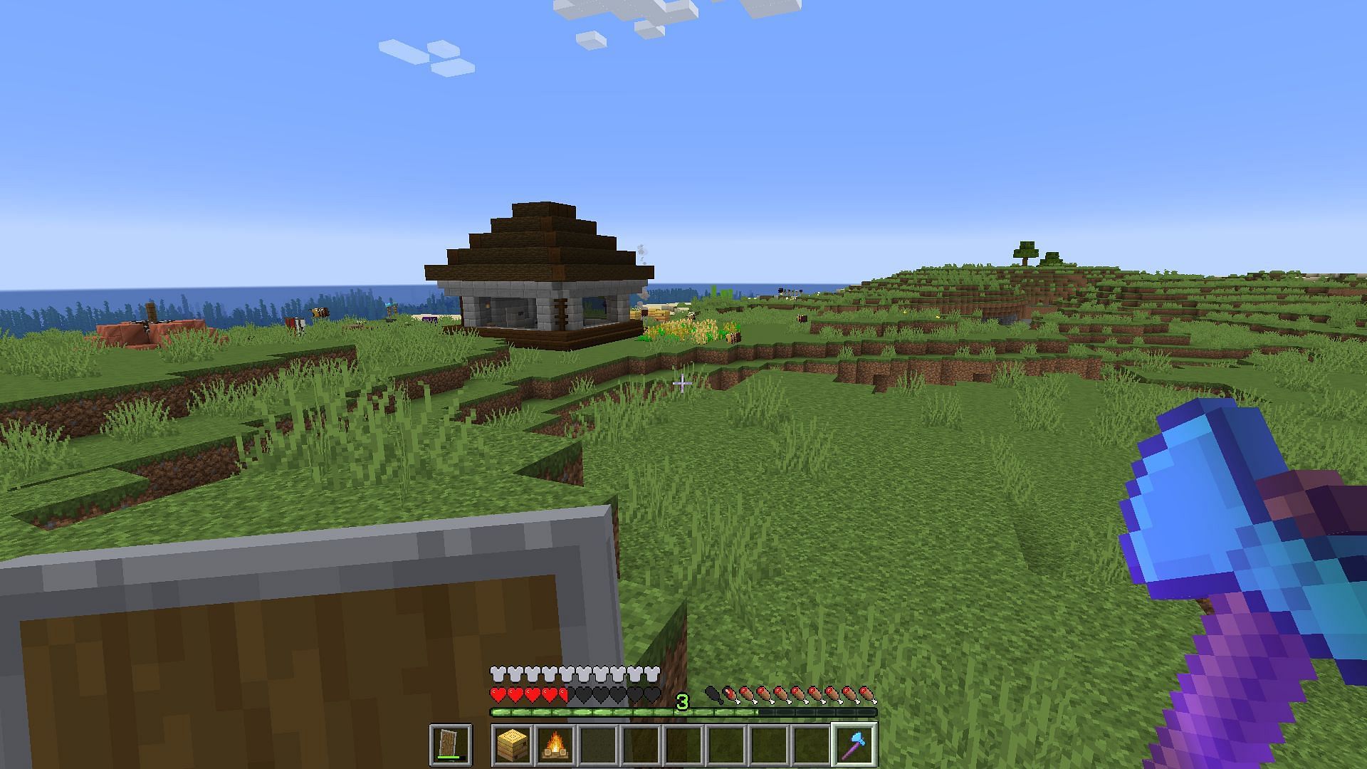 A player having picked up a bee nest with a silk touch axe (Image via Minecraft)