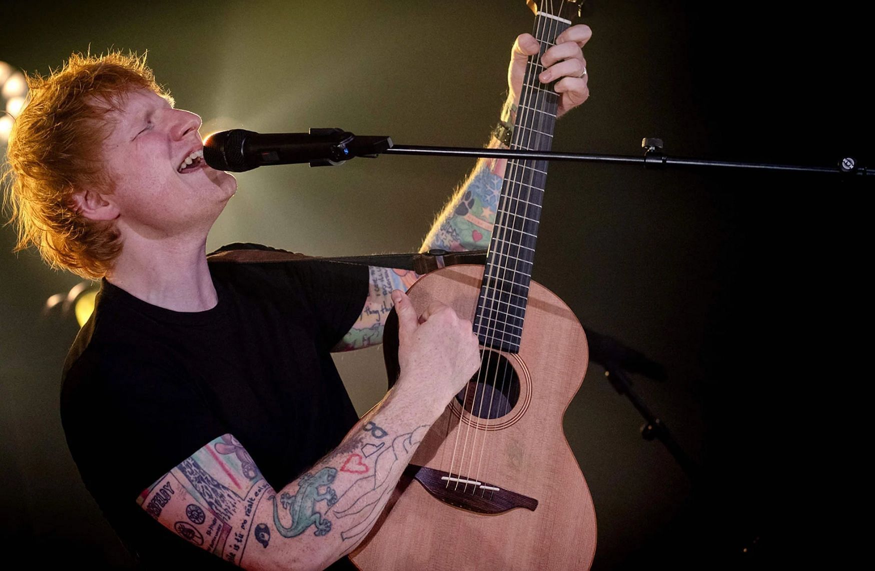 Ed Sheeran during a live performance (Image via AFP)