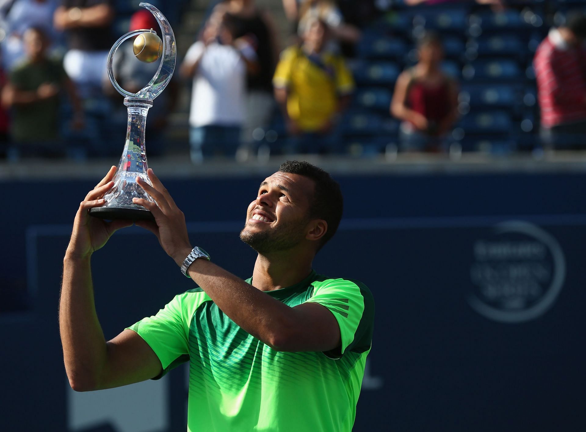 Jo-Wilfried Tsonga lifts the Rogers Cup trophy in 2014