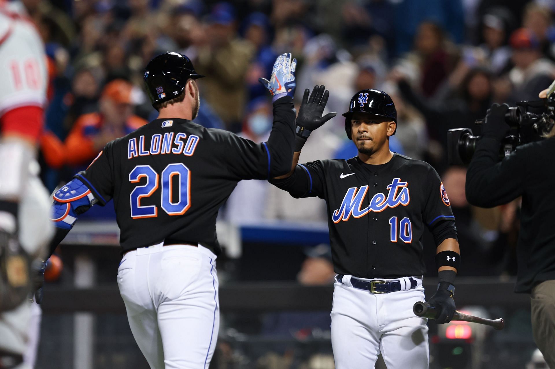 Pete Alonso crosses home plate after a home run during a Philadelphia Phillies v New York Mets game.