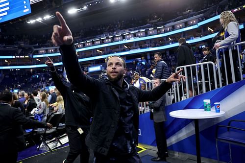 Steph Curry interacts with fans following the Golden State Warriors' win over the Utah Jazz.