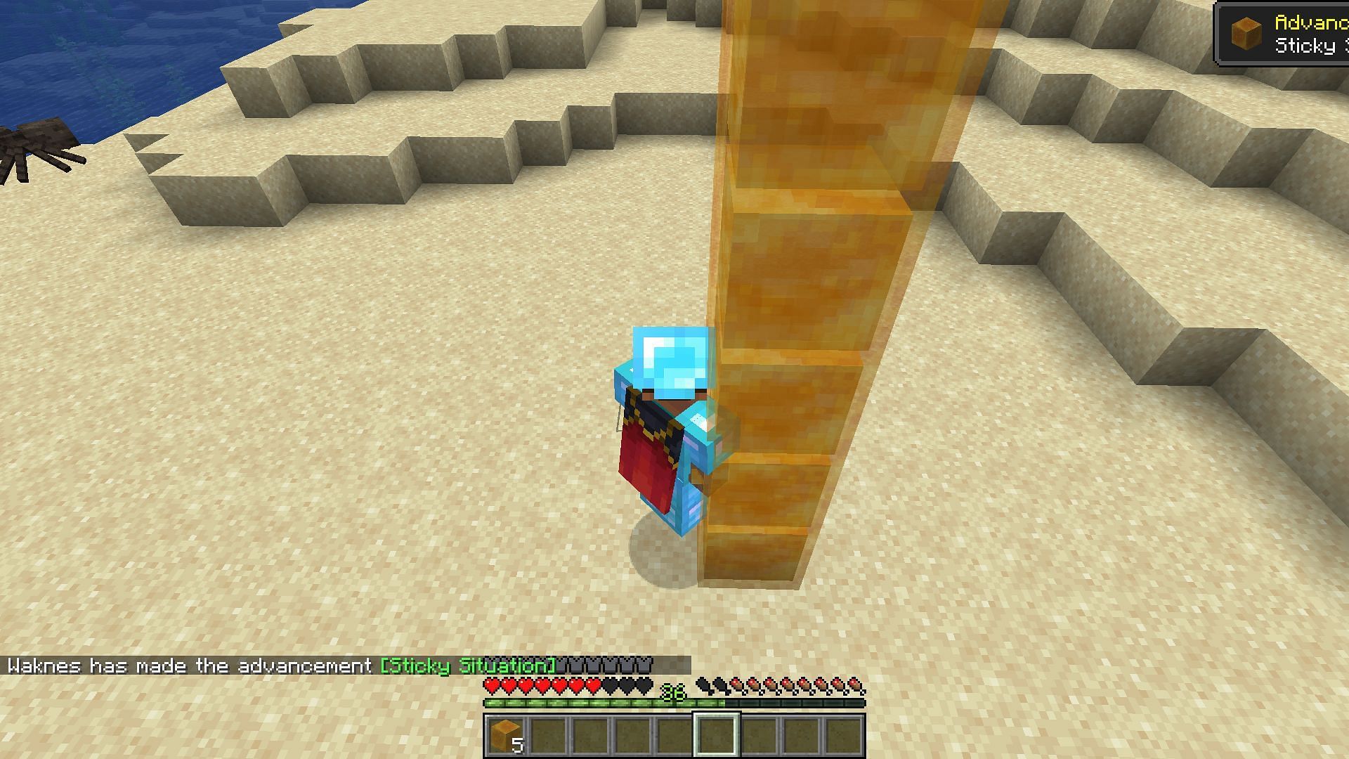 A player sliding down a great height using honey blocks (Image via Minecraft)