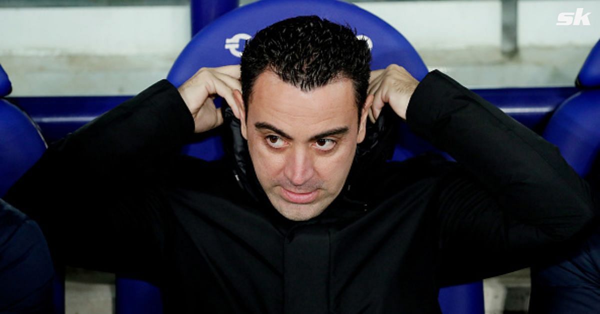 Barcelona manager Xavi Hernandez looks on.