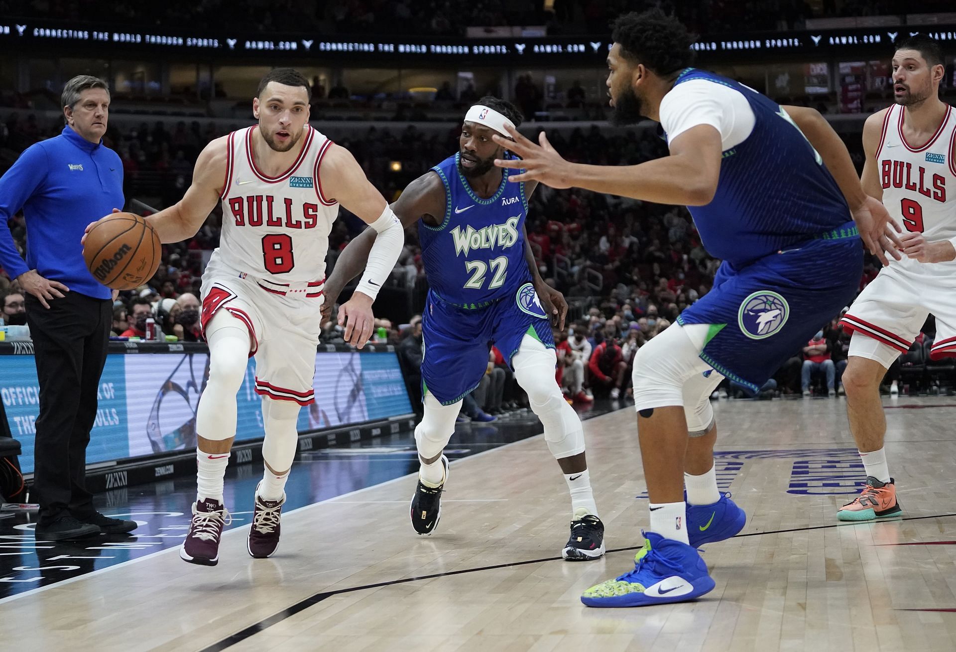 Zach LaVine of the Bulls against Patrick Beverley and Karl-Anthony Towns of the Timberwolves