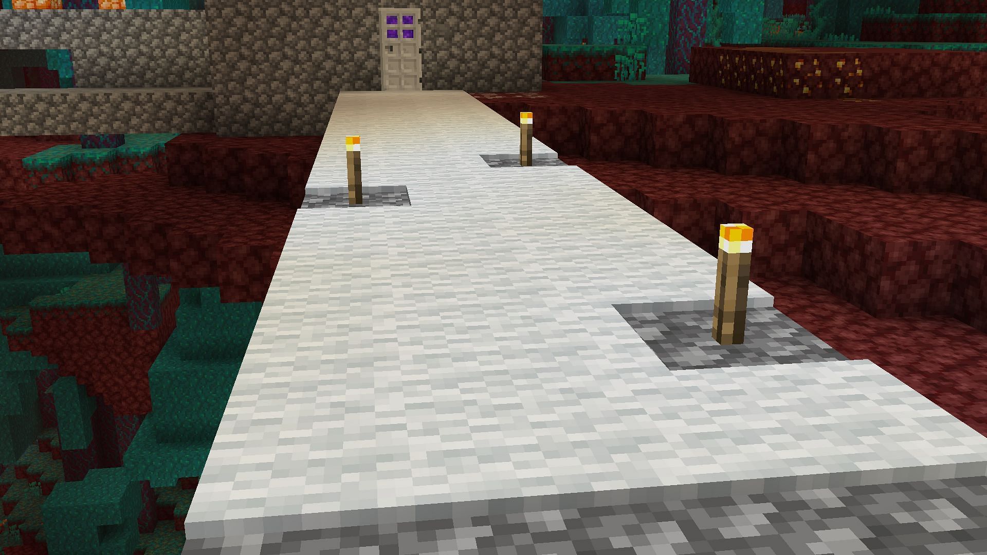 Using carpets or torches to spawn proof (Image via Minecraft)
