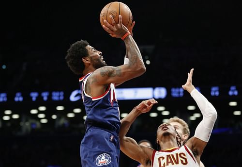 Kyrie Irving (L) in action during the Brooklyn Nets' game against the Cleveland Cavaliers