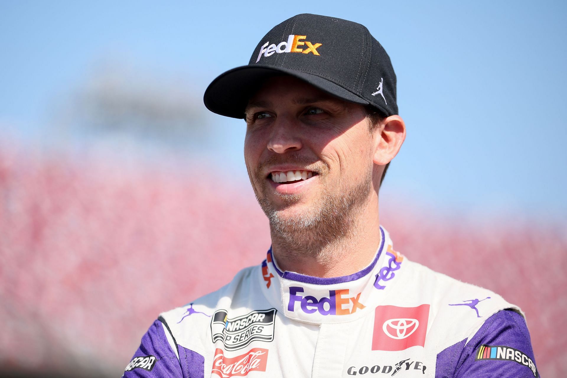 Denny Hamlin waits on the grid during qualifying for the NASCAR Cup Series GEICO 500 at Talladega Superspeedway (Photo by James Gilbert/Getty Images)