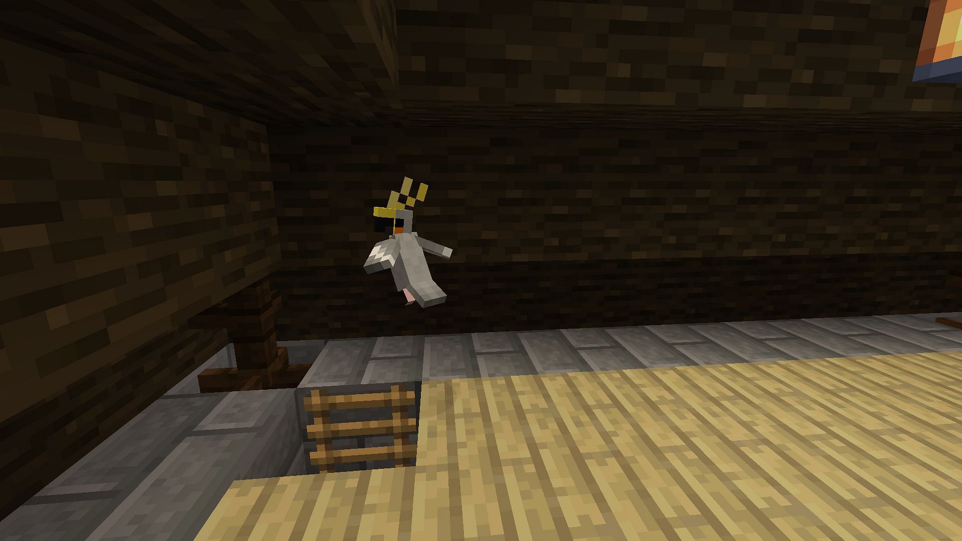 A tamed parrot in a player&#039;s base attic (Image via Minecraft)
