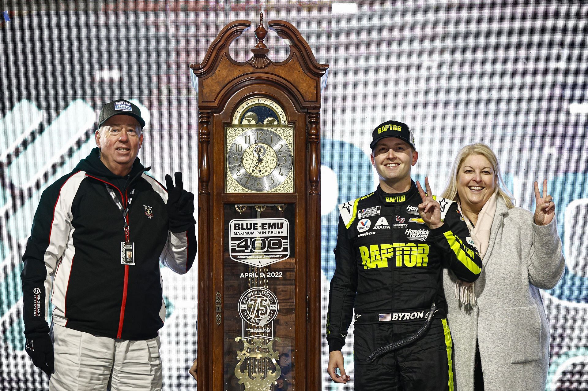 William Byron celebrates winning the 2022 NASCAR Cup Series Blue-Emu Maximum Pain Relief 400 with his parents at Martinsville Speedway in Virginia. (Photo by Jared C. Tilton/Getty Images)