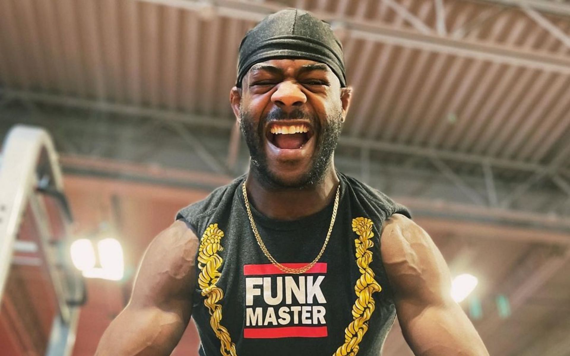 Aljamain Sterling flexing his physique [Image Courtesy: @funkmastermma on Instagram]