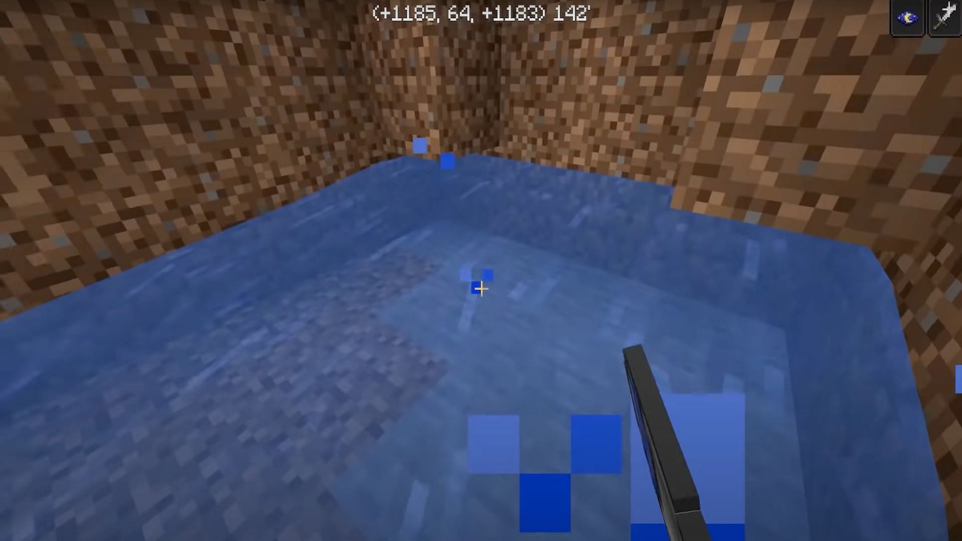 Players should place water from a bucket all along the back wall where they dug out the two corner blocks (Image via Dusty DudeYouTube)