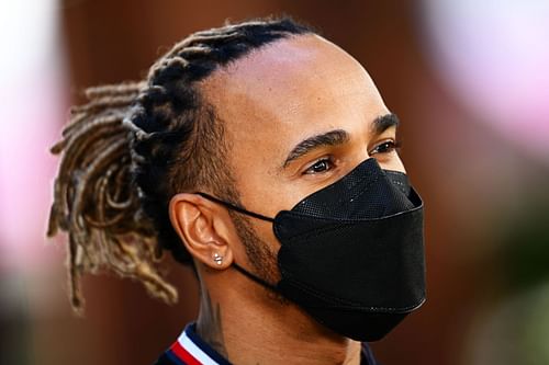 Lewis Hamilton looks on in the Paddock before practice ahead of the F1 Grand Prix of Australia (Photo by Clive Mason/Getty Images)