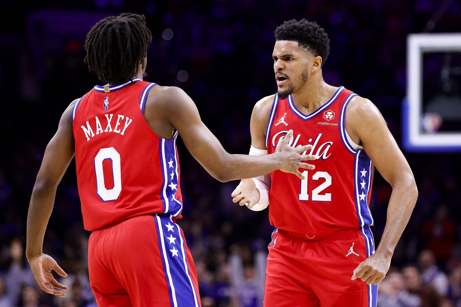 Tobias Harris and Tyrese Maxey celebrate a play