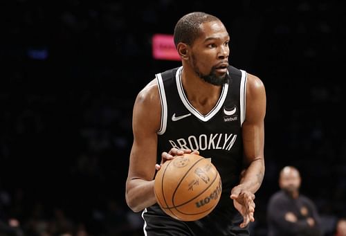 Kevin Durant No. 7 of the Brooklyn Nets looks to pass during the first half of the Eastern Conference 2022 Play-In Tournament against the Cleveland Cavaliers.