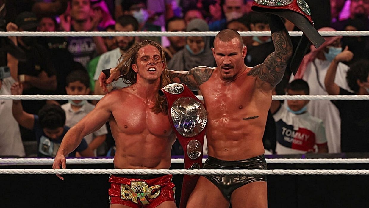 Randy Orton and Riddle celebrate in the ring