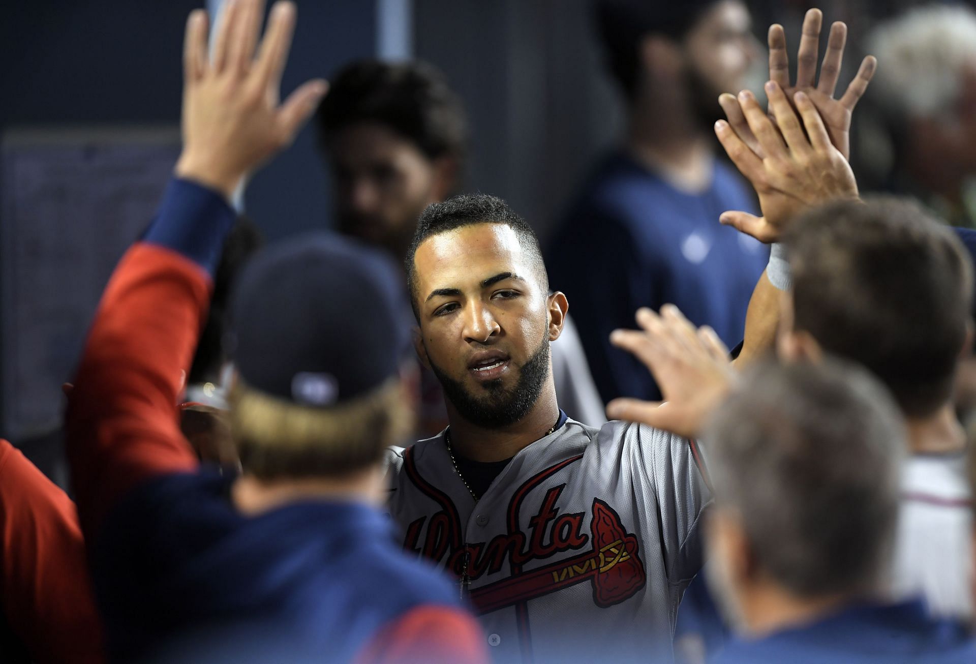 Eddie Rosario being congratulated in the dugout