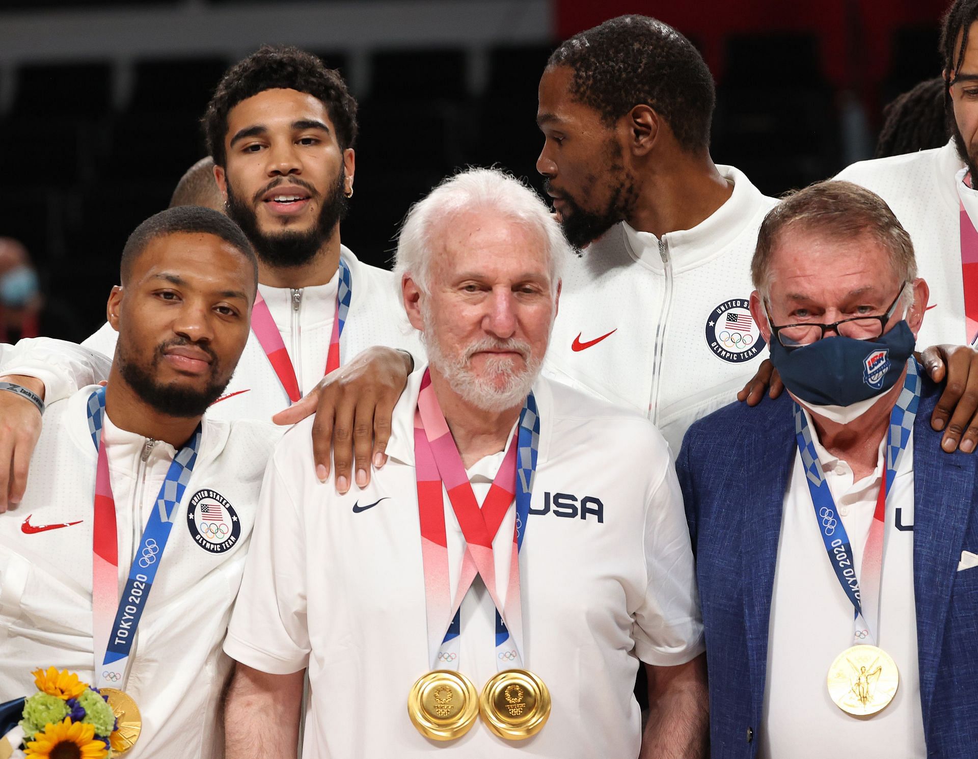 Team USA coach Gregg Popovich poses with Damian Lillard, Jayson Tatum, Kevin Durant and Jerry Colangelo during the men's basketball medal ceremony at the Tokyo Olympics on Aug. 7, 2021 in Saitama, Japan.