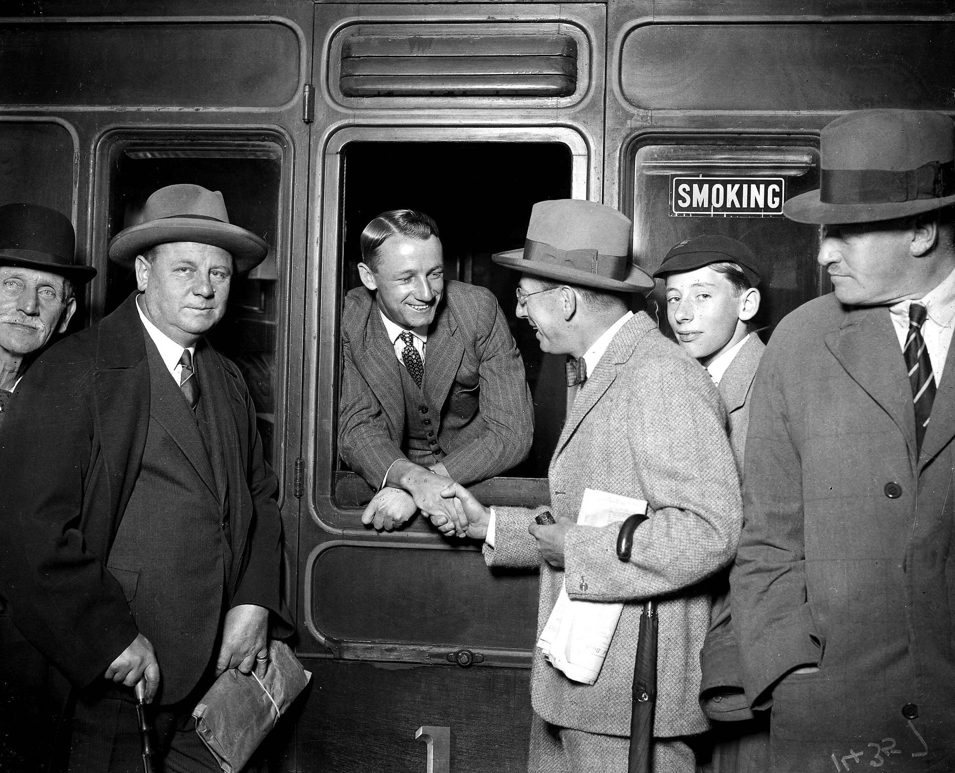 Don Bradman looking out of a railway coach but it was Bill O&#039;Reilly who fortutiously hopped off a train for his first encounter with young Don