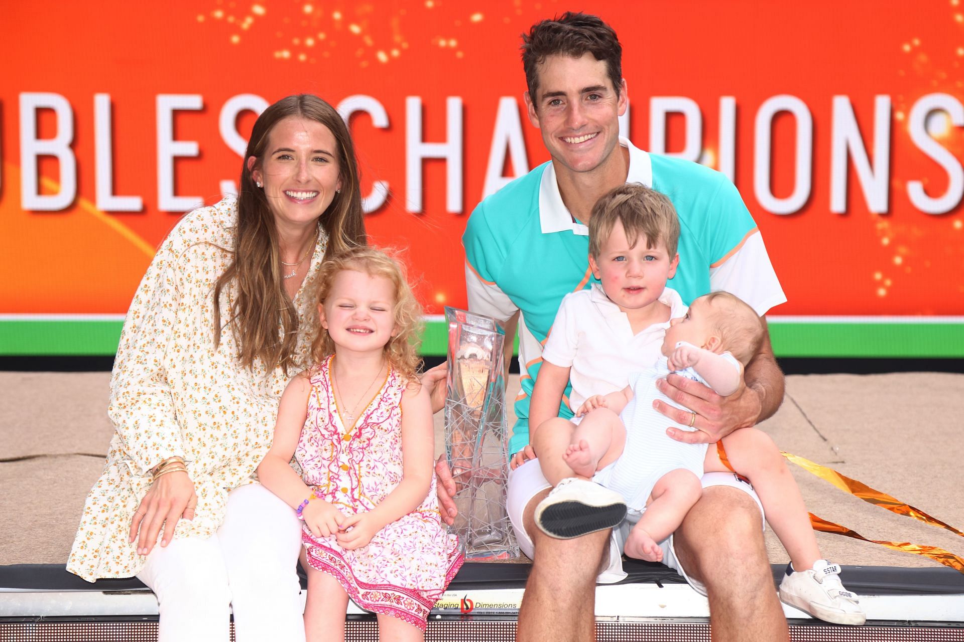 John Isner celebrates winning the doubles title at the 2022 Miami Open.