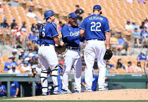 Clayton Kershaw on the mound with manager Dave Roberts and catcher Will Smith