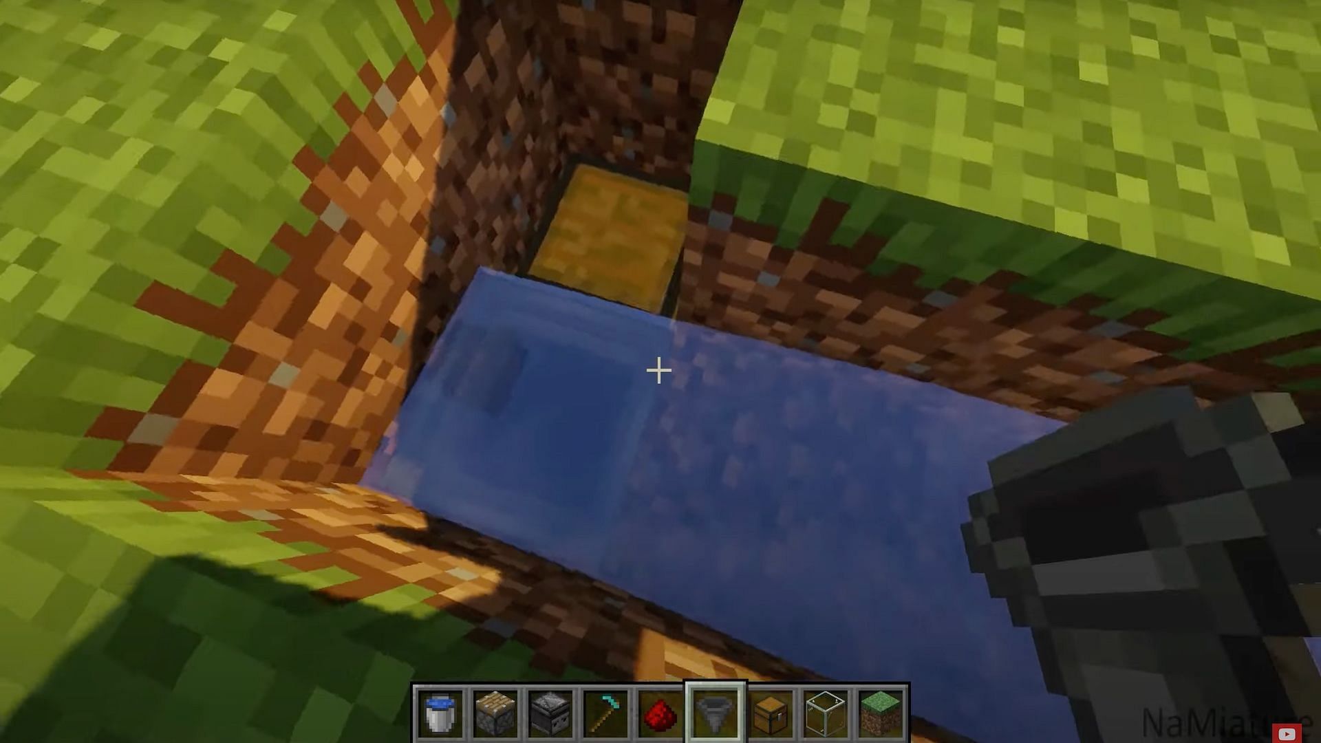 Fill the hole with the hopper and chest to gather materials (Image via NaMiature/YouTube)