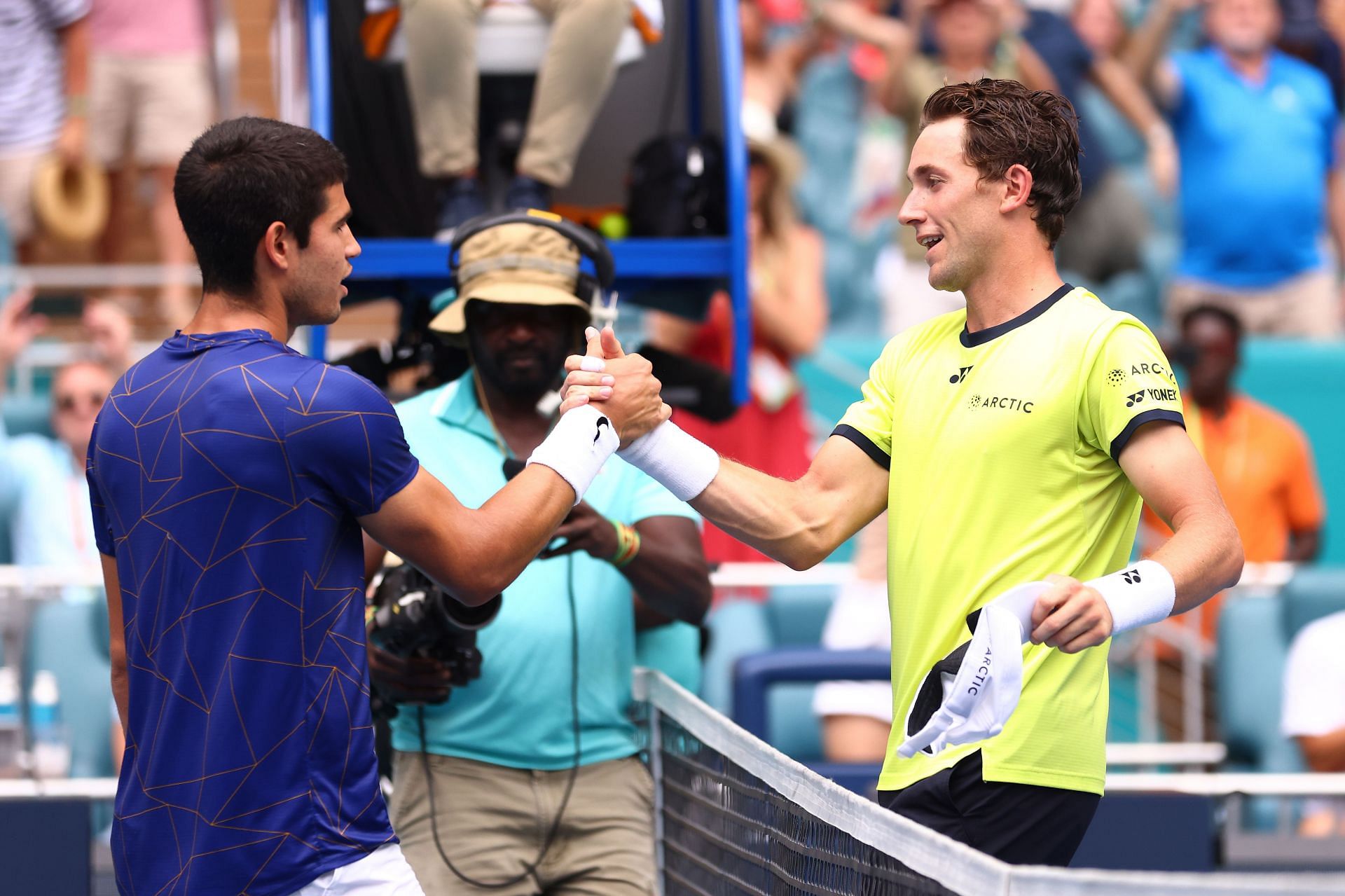 Casper Ruud shakes hands with Miami Open champion Carlos Alcaraz at the end of their tussle