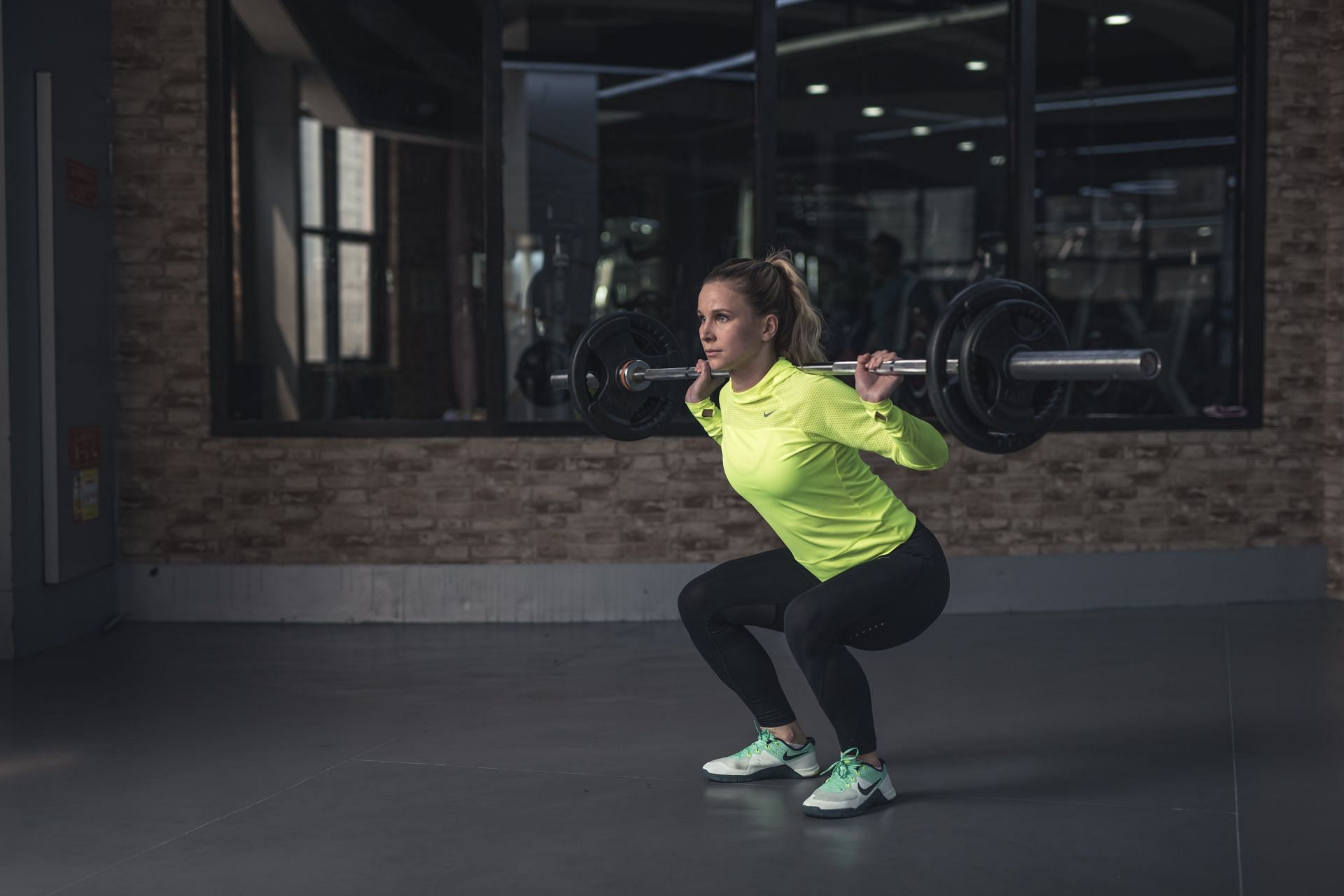 Box squats can be done with only your bodyweight or with any weighted equipment (Image via Pexels/Li Sun)