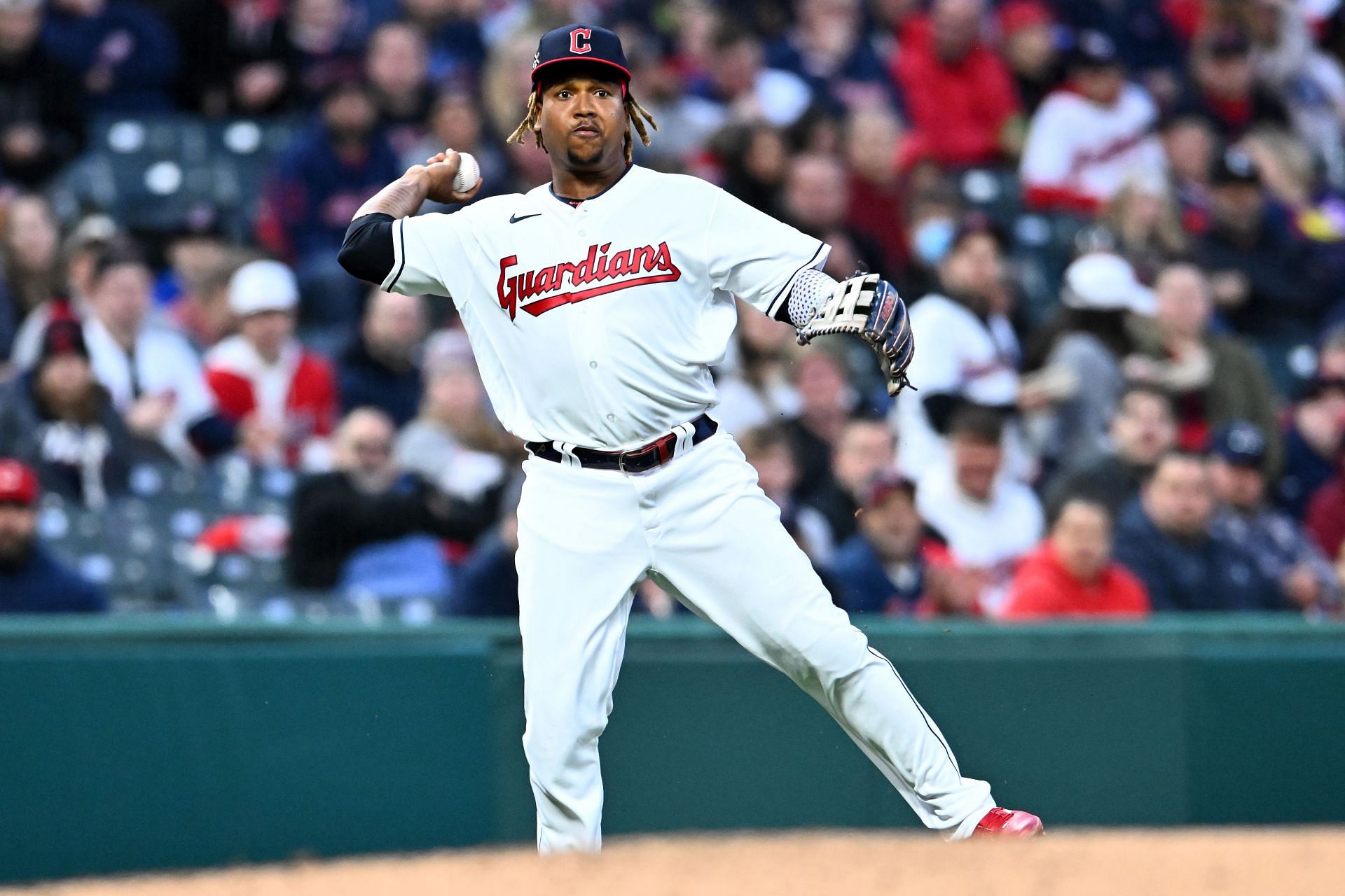 Jose Ramirez throws to first base during a San Francisco Giants v Cleveland Guardians game.